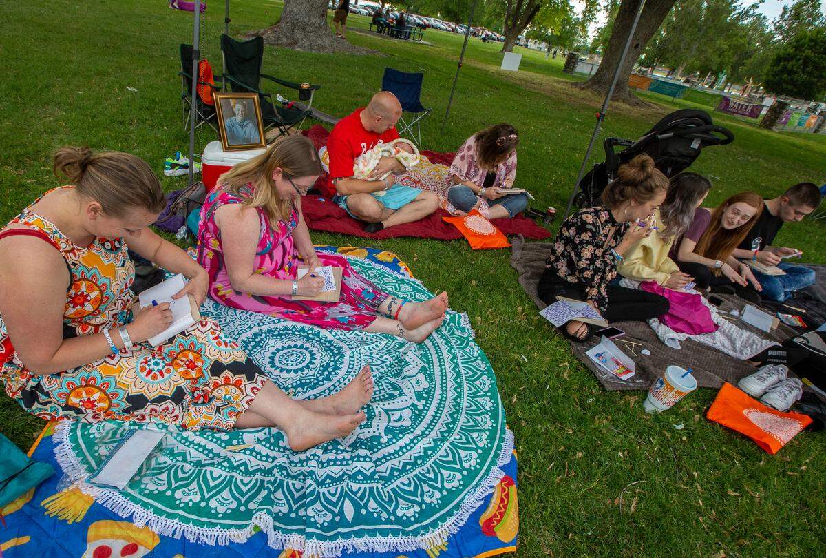 Hunter Black’s family and friends gather at the Water Lantern Festival at Columbia Park to memorialize him at the event.