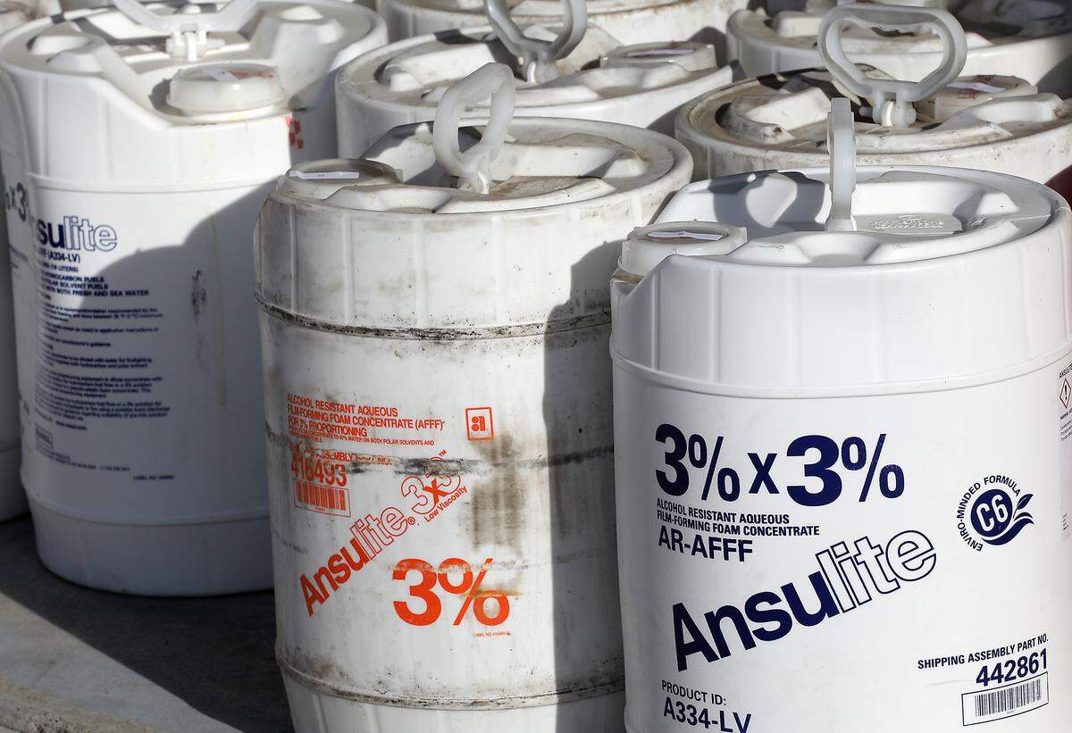 Containers of aqueous film-forming foam are staged for workers from Clean Harbors Environmental Services to package and haul from the Pasco Fire Department Fire Station at the Tri-Cities Airport.