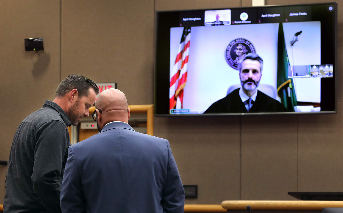 Benton County Commissioner Will McKay Jr., left, confers with his defense attorney Nick Jones, during a May hearing in Benton County Superior Court.