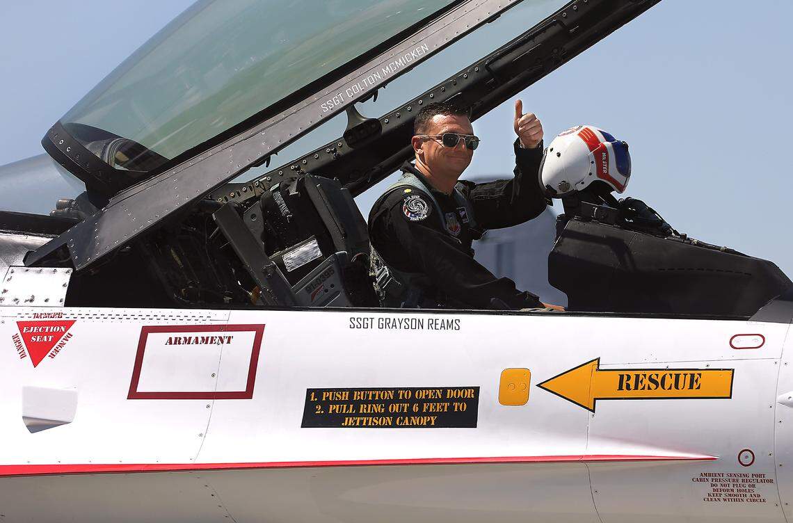 Maj. Taylor Hiester, a commander and pilot for the U.S. Air Force F-16 Viper Demonstration Team, gives a thumbs up to people gathered near Bergstrom Air after landing Thursday at the Tri-Cities Airport in Pasco. The team is based at the Shaw Air Force Base in Sumter, S.C.