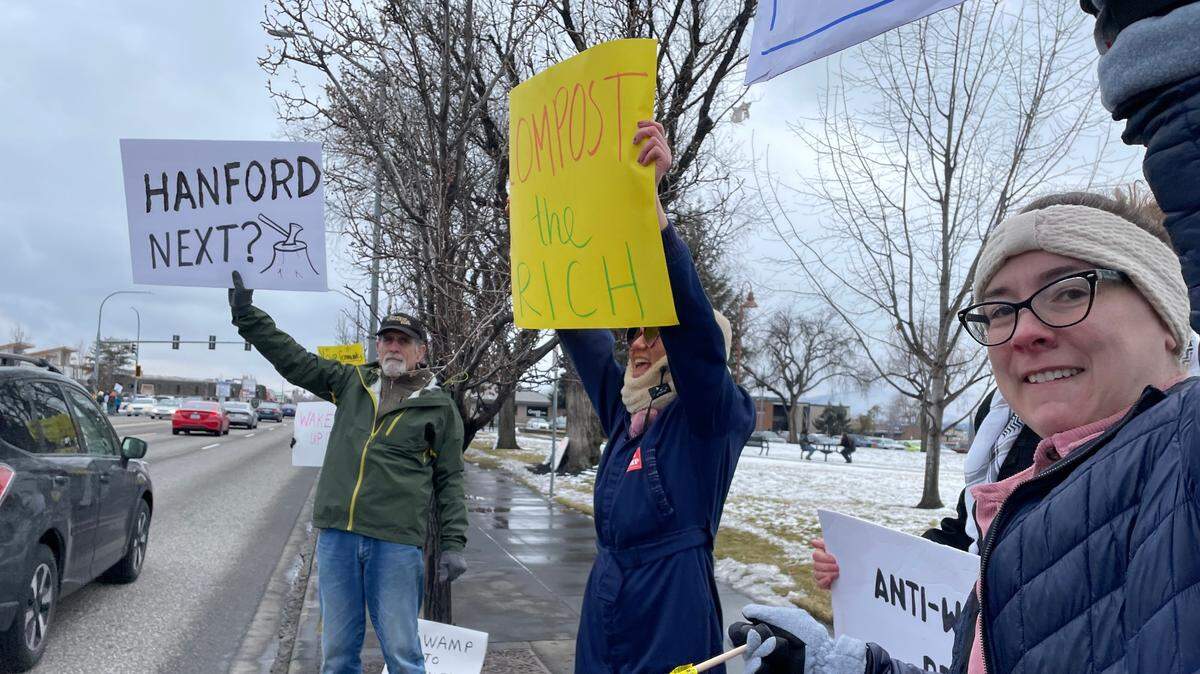 More than 100 people gathered along George Washington Way in Richland the afternoon of George Washington’s birthday to raise concerns about the actions of the Trump administration.