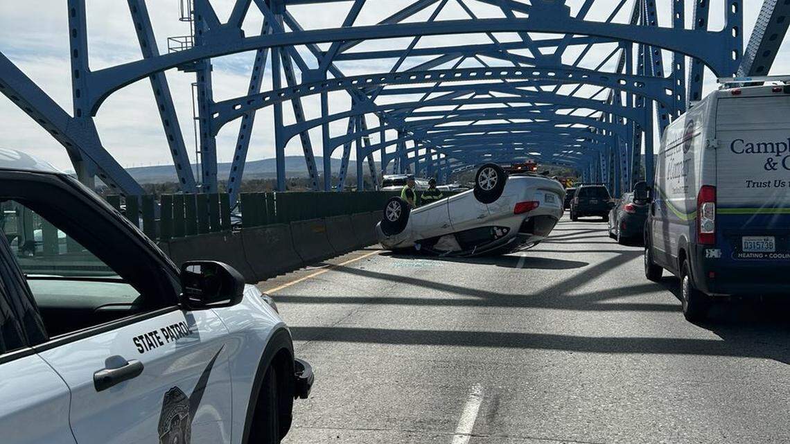 Drivers wouldn’t let tow truck past after rollover crash on blue bridge