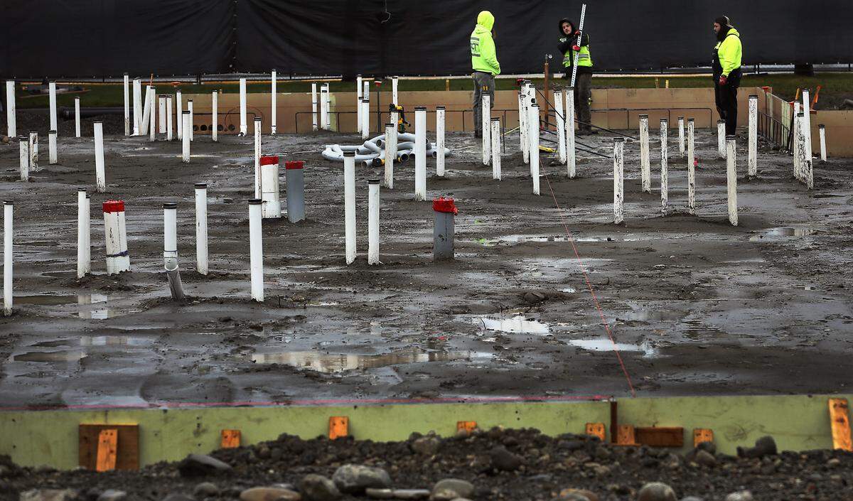 Construction crews work at the site of the new 5,000-square-foot Chick-fil-A restaurant at 7009 W. Canal Drive in Kennewick. The new building includes a kitchen, inside seating for 70, patio seating for 24, 96 parking stalls and features a two-lane drive through. The existing parking lot has fenced off for the installation of buried utilities and construction of the structure. Photo taken on Dec. 24, 2024.