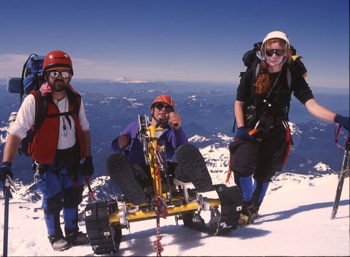 Special to the Herald/George Waymire Paul Soboleski and Linda Soper walk beside Pete Rieke as he makes his way into Camp 5 near 12,500 feet on Mount Rainier.