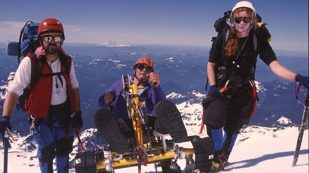 Special to the Herald/George Waymire Paul Soboleski and Linda Soper walk beside Pete Rieke as he makes his way into Camp 5 near 12,500 feet on Mount Rainier.