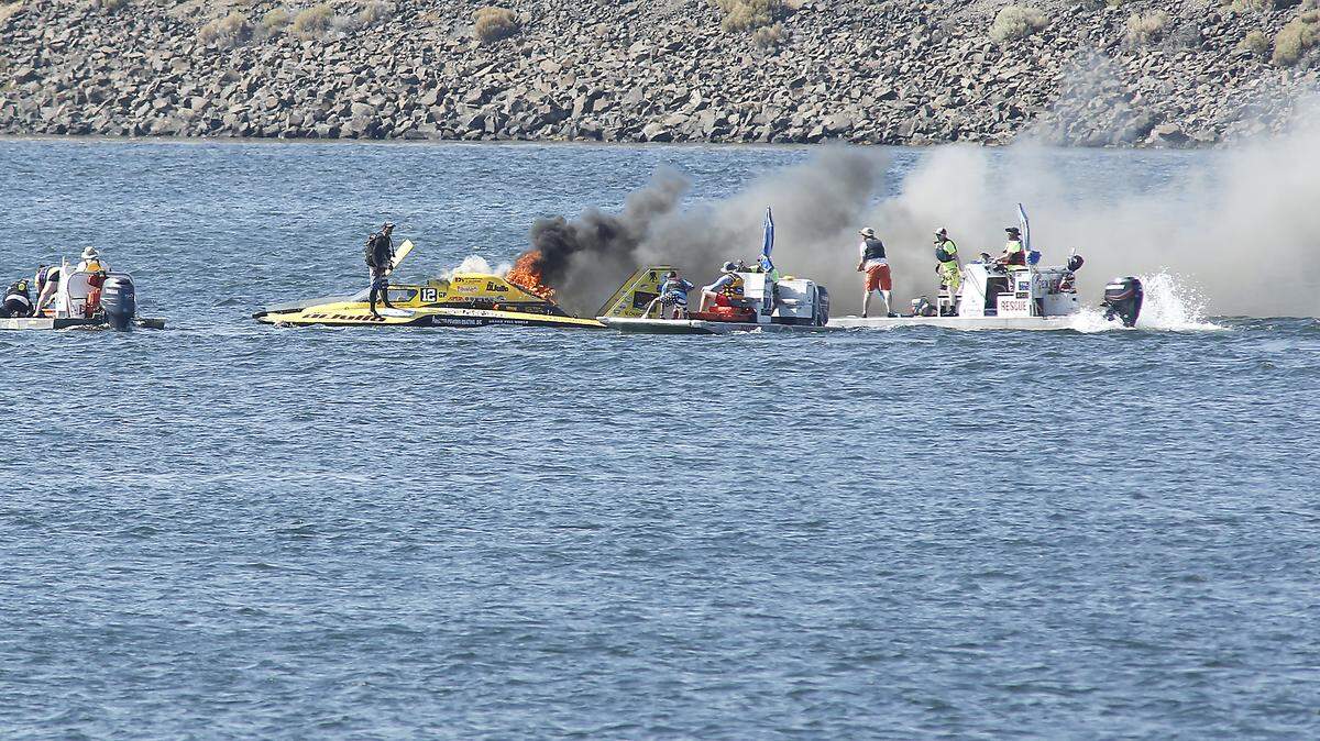 A Grand Prix boat driver appears to have gotten out of a boat after it caught fire during Tri-City Water Follies.