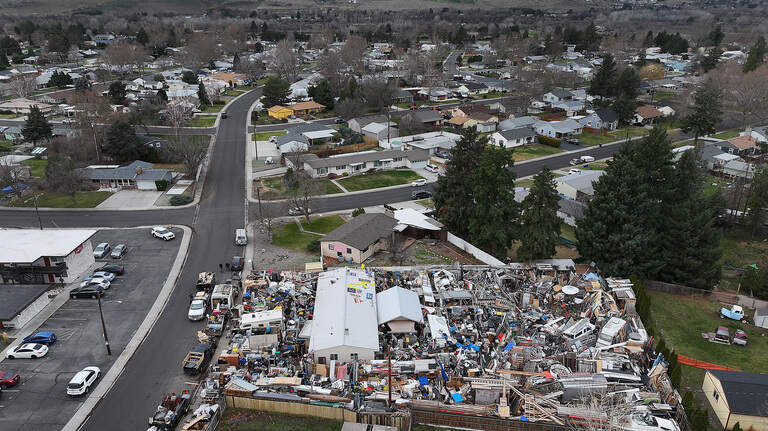 Mountain of debris engulfs home. Richland calls it an ‘immediate threat’