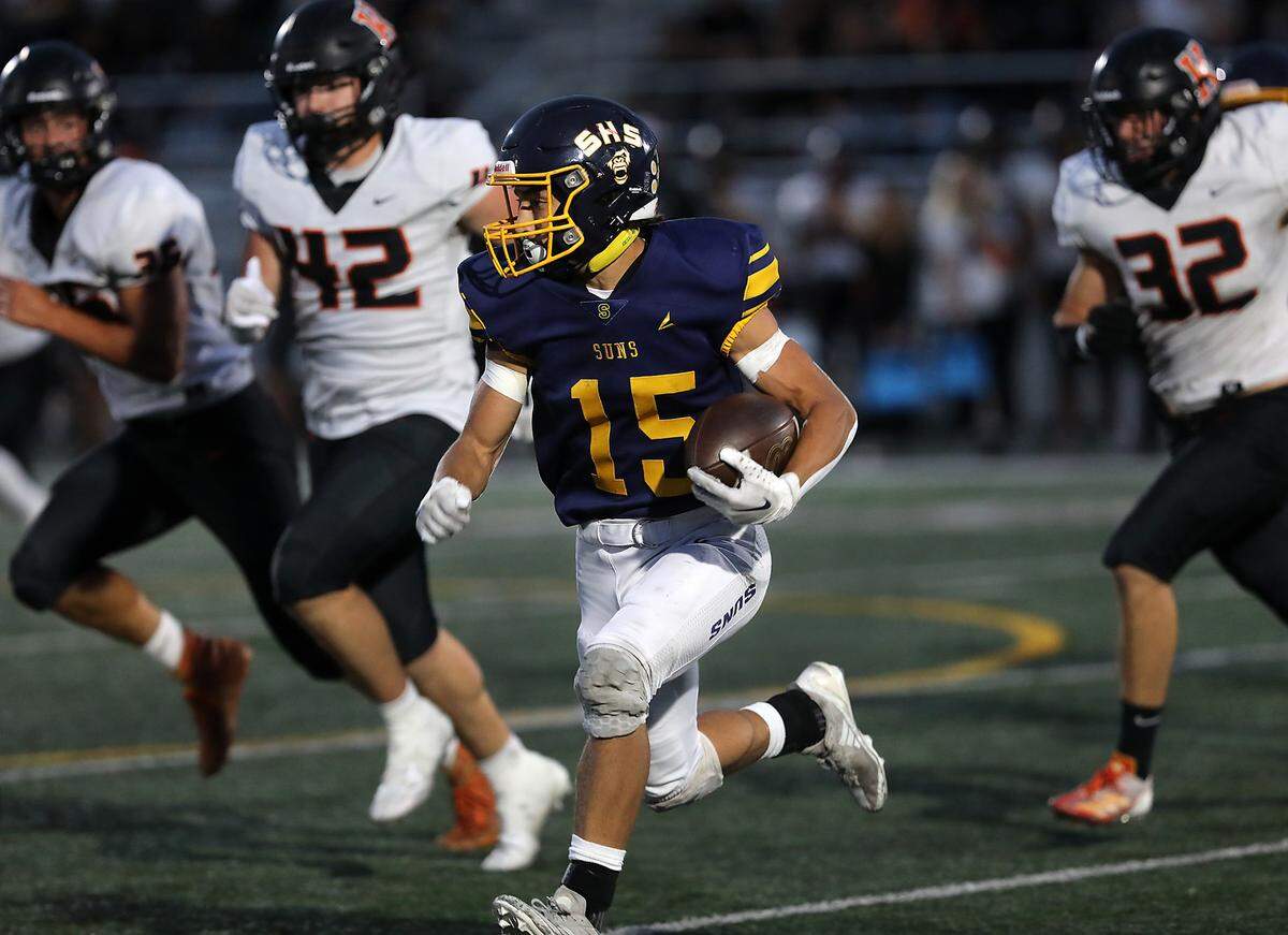 Southridge running back Gabriel Borisch looks for an opening as he scampers for yardage as Kennewick defenders pursue during their game Friday Sept. 13, 2024 at Lampson Stadium in Kennewick.