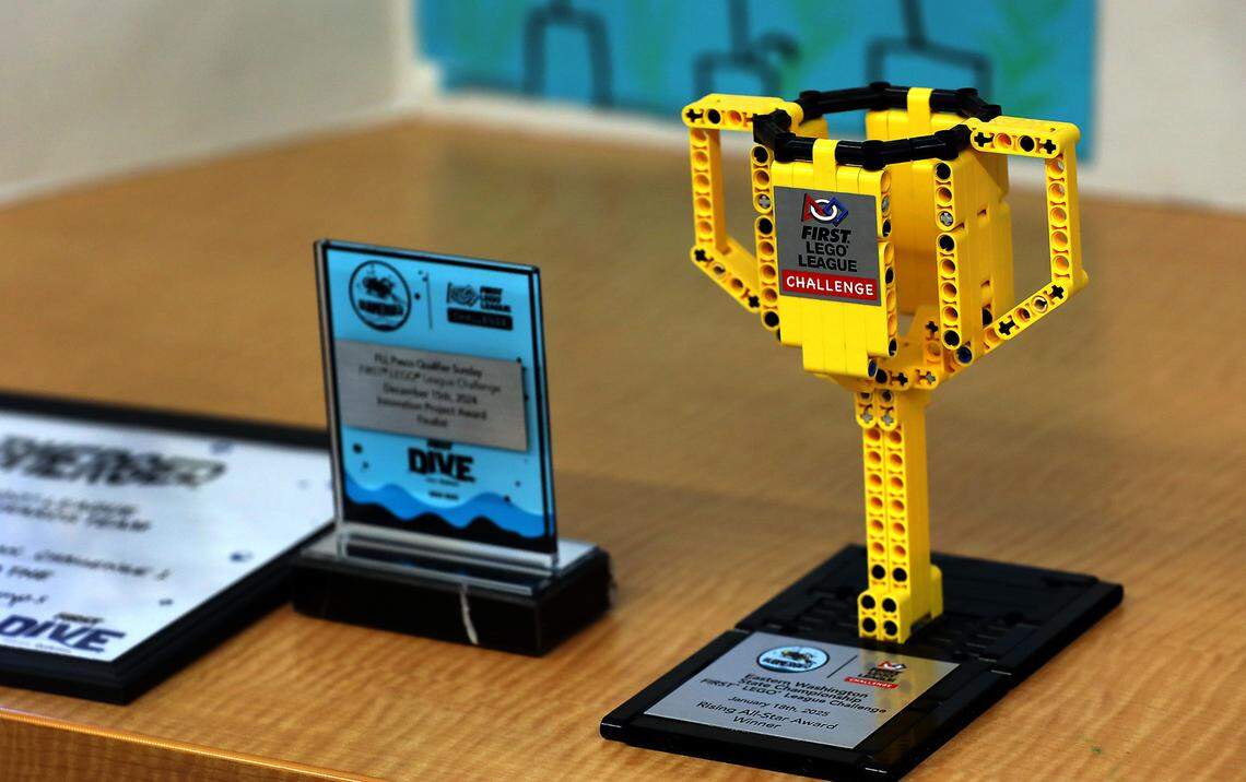Trophies and awards won by the Dino Nuggys First LEGO League team are displayed on a table in the STEM classroom at Marcus Whitman Elementary School in Richland.