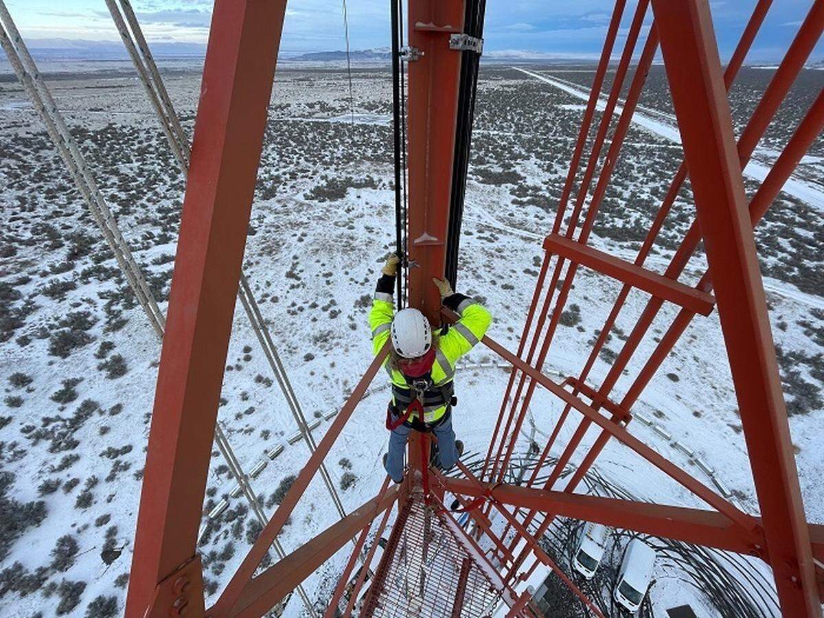 Bryan Hurt, a field support worker with Hanford Mission Integration Solutions, installs cables and antennas on the Hanford site’s 405-foot meteorological tower.