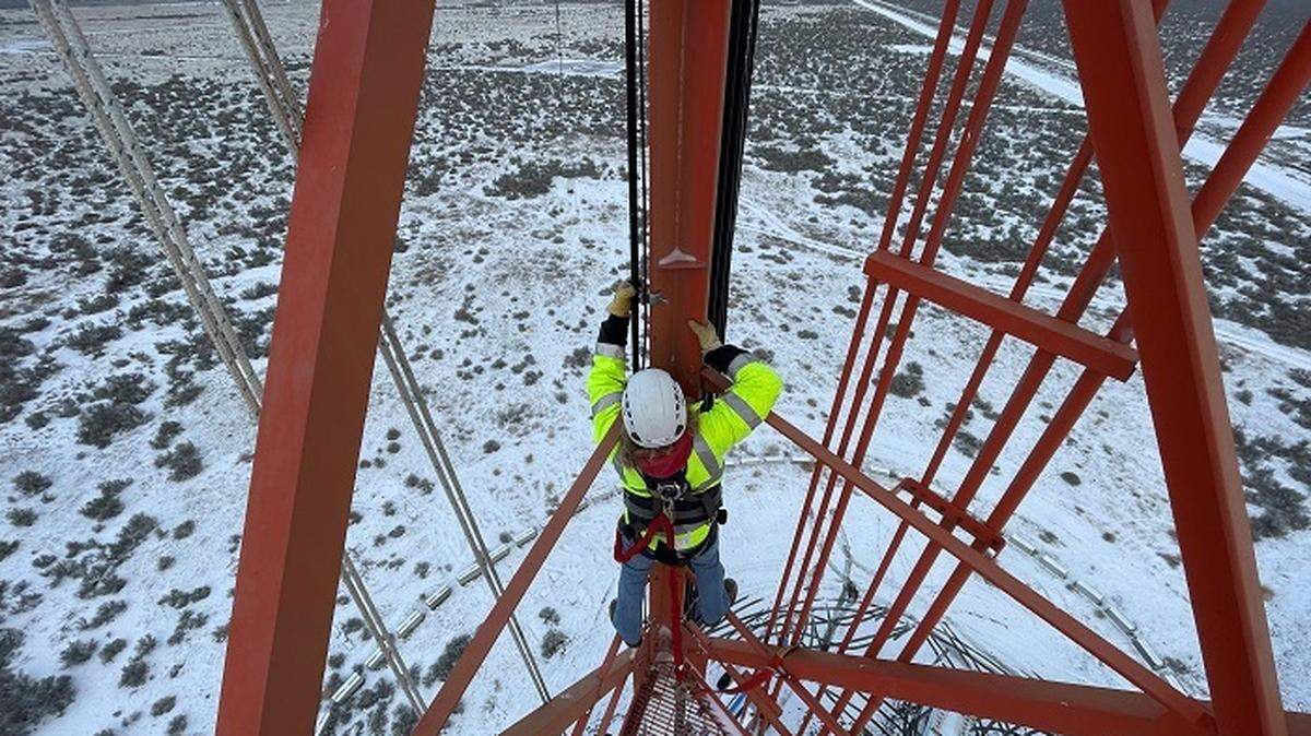 Bryan Hurt, a field support worker with Hanford Mission Integration Solutions, installs cables and antennas on the Hanford site’s 405-foot meteorological tower.