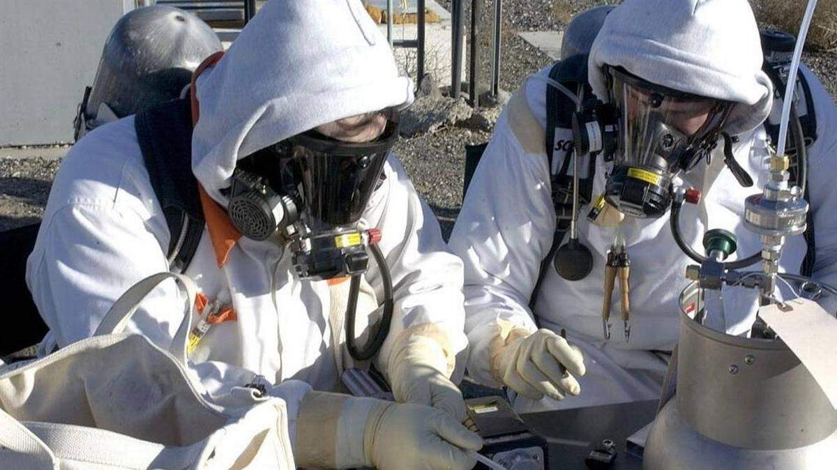 Investigators for the Department of Energy Office of Inspector General heard concerns about how claims for exposure to chemical vapors at the Hanford tank farms were handled. Workers wear supplied air respirators to keep from breathing the vapors.