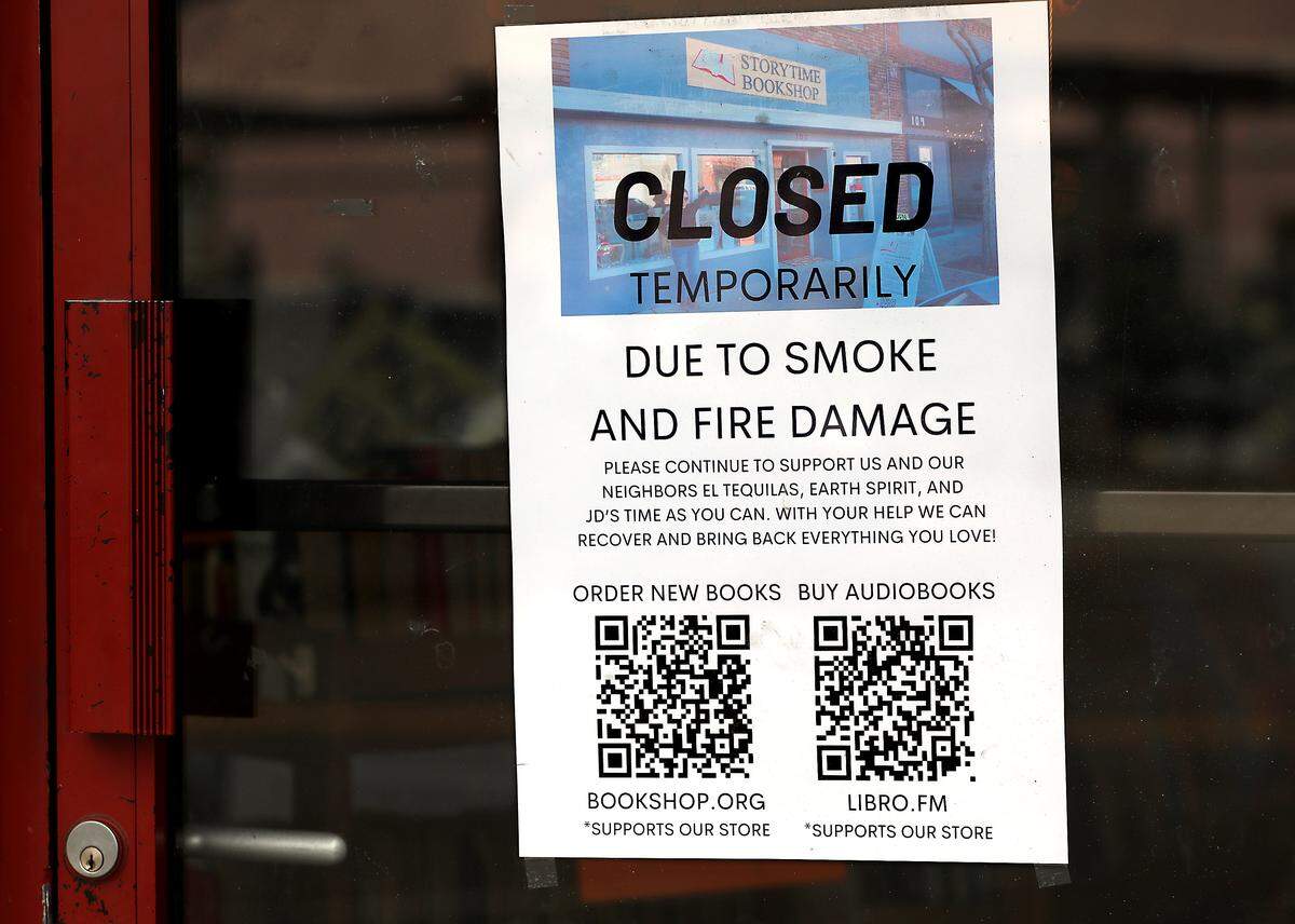 A printed sign posted on the front door of the Storytime Bookshop at 107 W. Kennewick Ave. informs customers of their temporary closure following Tuesday morning's fire at the adjacent restaurant in downtown Kennewick.