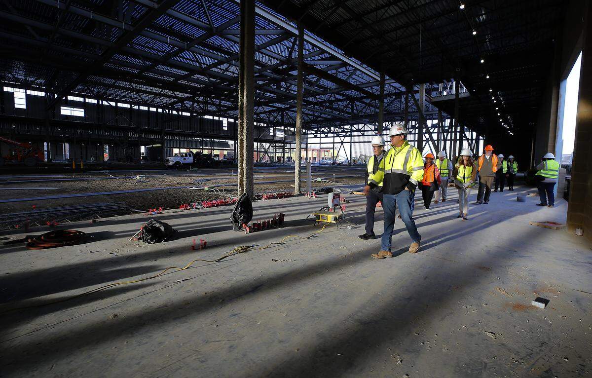 Project superintendent Ryan Ford, with Lydig Construction, conducts a walk-through tour of the Three Rivers Convention Center renovation and expansion project in Kennewick 