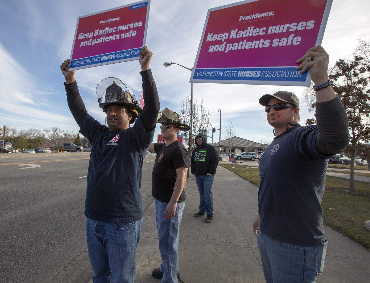 Firefighters and paramedics from Kennewick and Richland show support for Kadlec nurses and rally with supporters at John Dam Plaza in Richland in March.