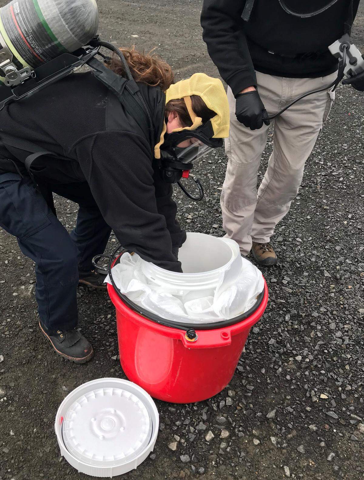 A device filled with chloropicrin, used as a chemical weapon during World War I, is prepared for disposal by the Washington State Patrol bomb squad.