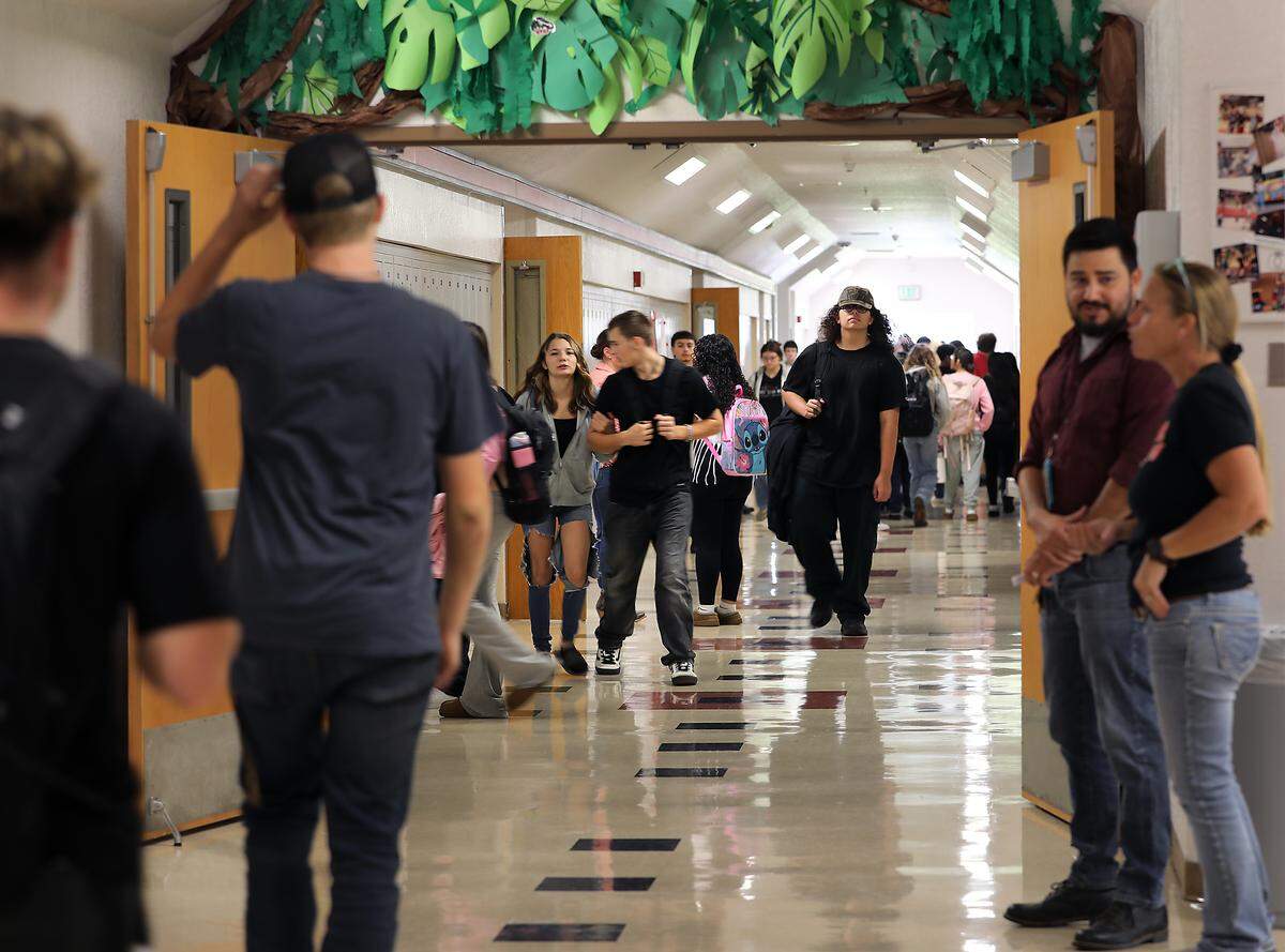 Students and staff fill the hallways at RiverView High School in Finley after the bell rings for a class change. The school district adopted a four-day school schedule this year.