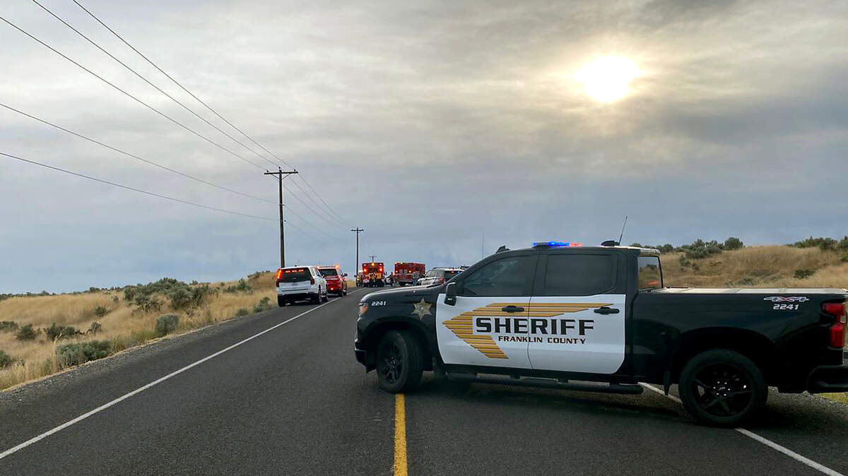 Franklin County Sheriff Office deputies investigate a fatal crash Friday morning on the Pasco-Kahlotus highway near Pasco.