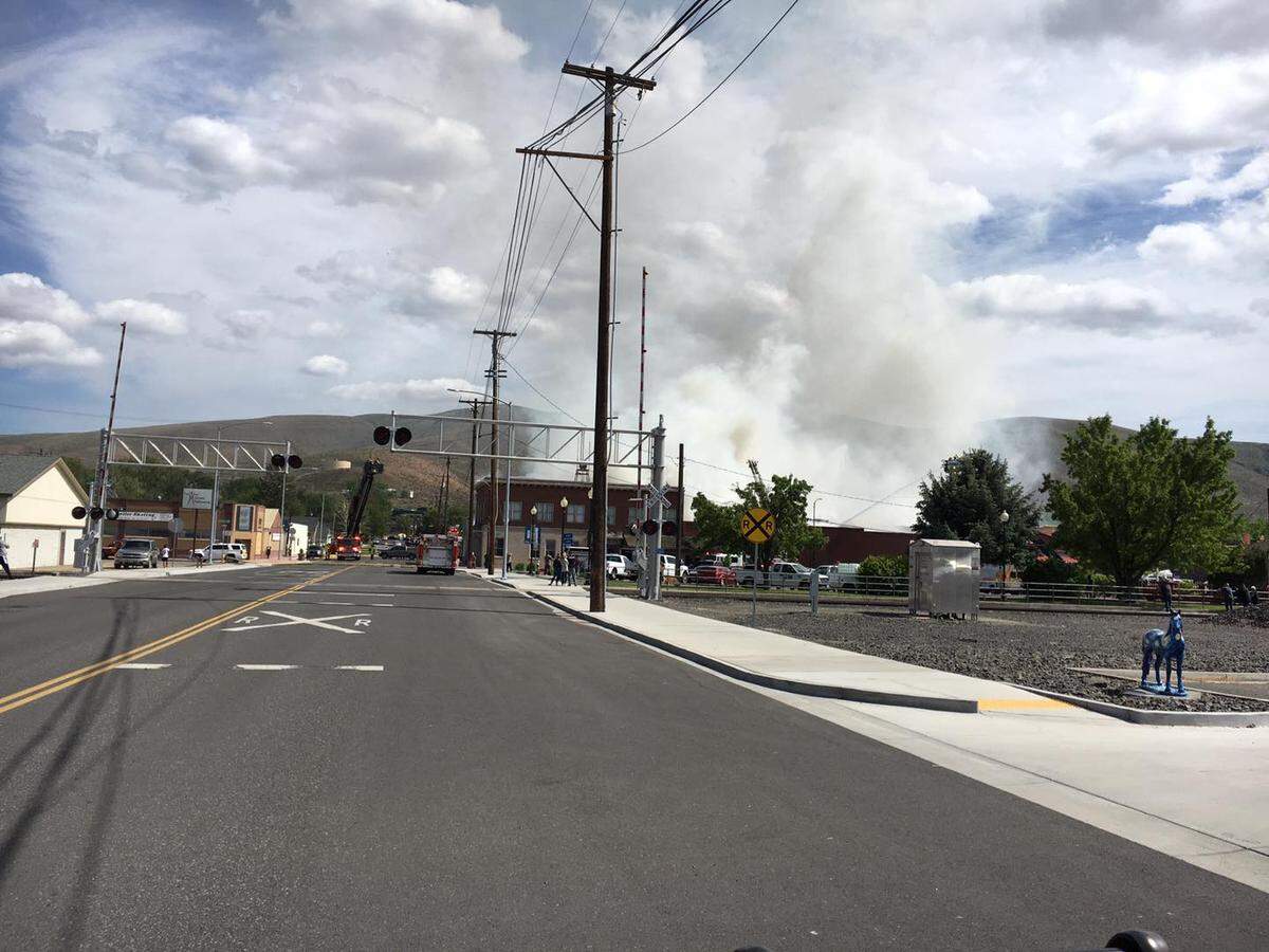 Smoke filled the air over downtown Prosser as crews battled a three-alarm fire at a row of businesses.