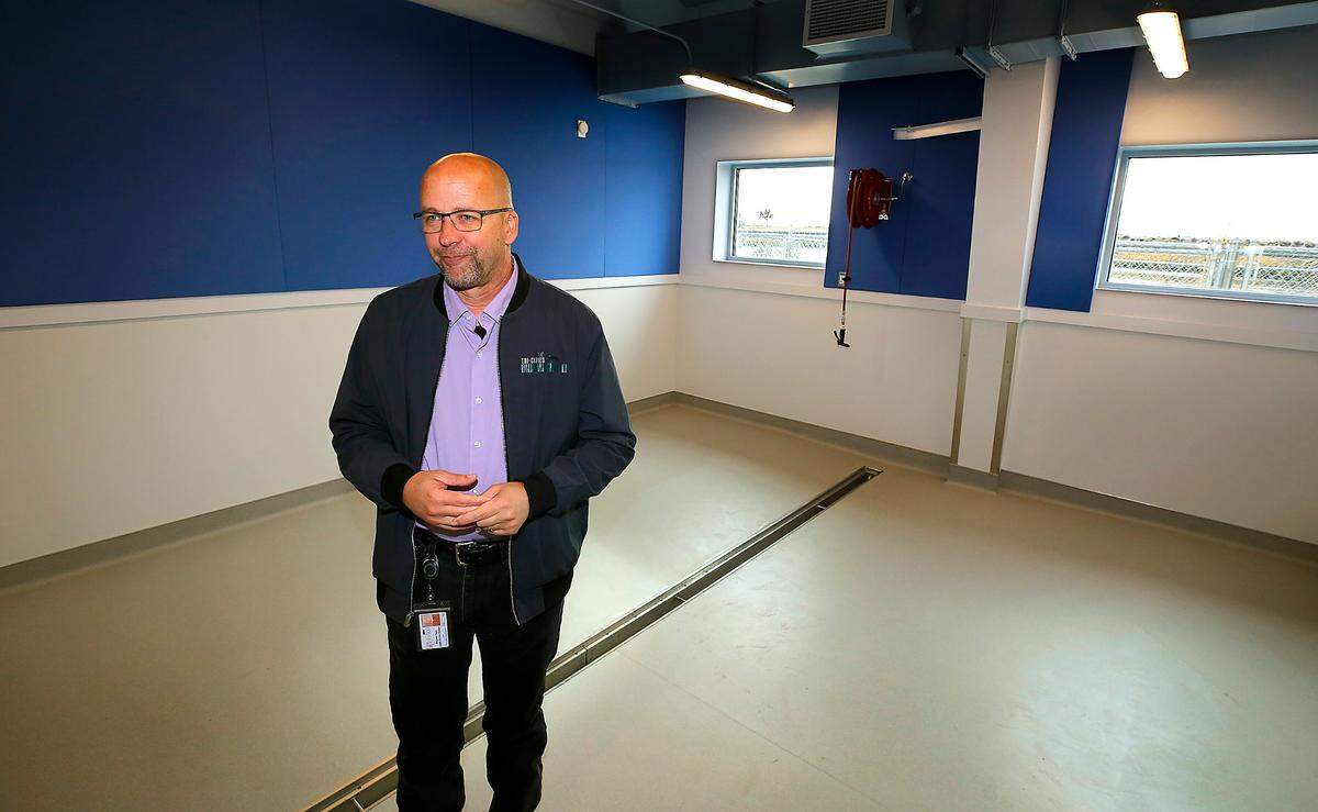 Ben Zigan, Tri-Cities Animal Shelter manager, stands in one of the new rooms that will be set up with kennels for dogs in the new shelter building in Pasco.