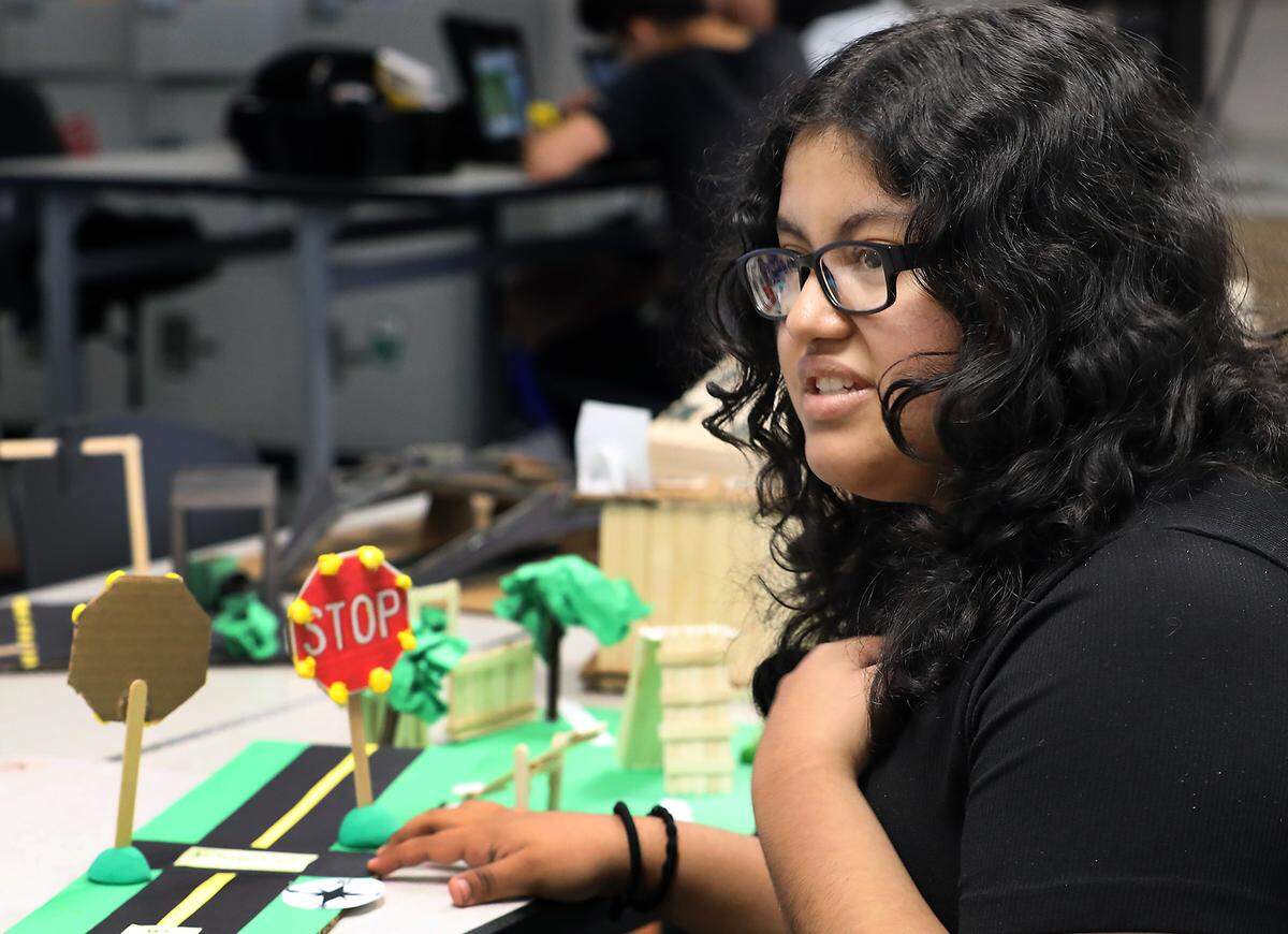 Stephanie Lopez, a freshman at Orion High School in Pasco, explains why she chose intersection safety on Highway 395 for her AI project. 