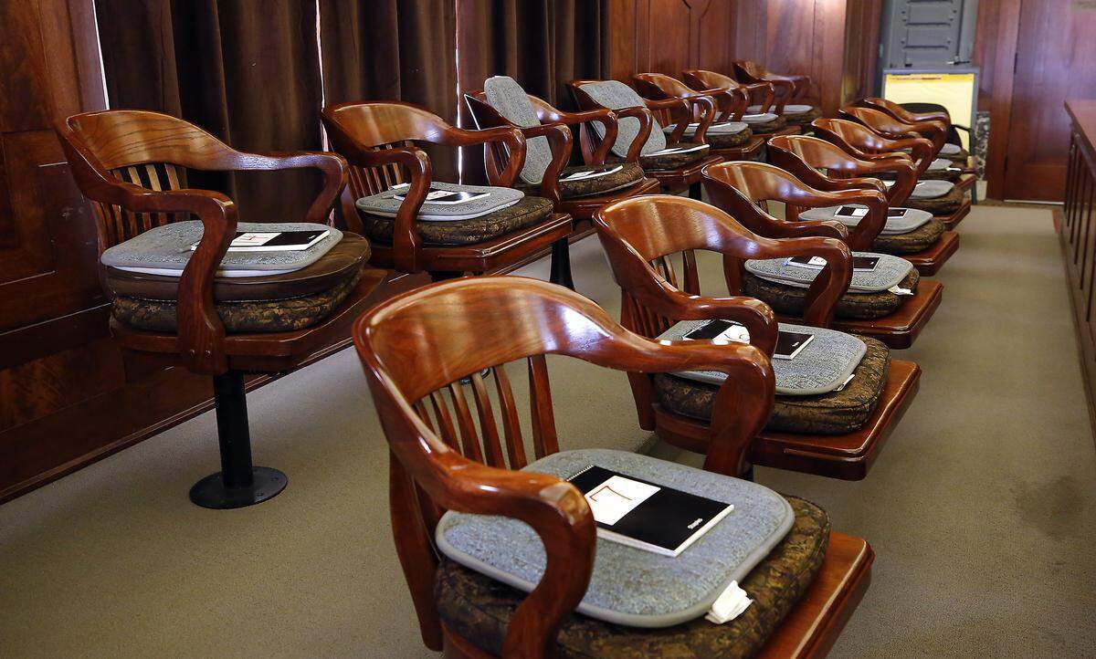 Jury box arranged with notebooks for jurors during a murder trial in Franklin County Superior Court in Pasco.