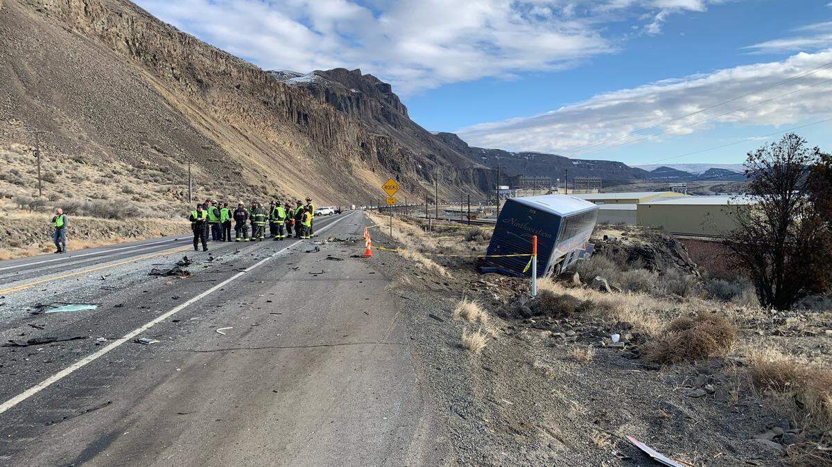 Four people died when a passing car hit an oncoming bus Sunday on Highway 28 along the Columbia River near Voltage, Wash.