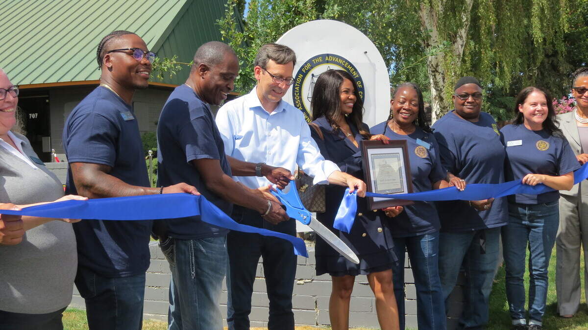 NAACP Chapter President Irving Brown and Gov. Bob Ferguson cut the ribbon for the new NAACP of Tri-Cities chapter building in Pasco on Saturday.