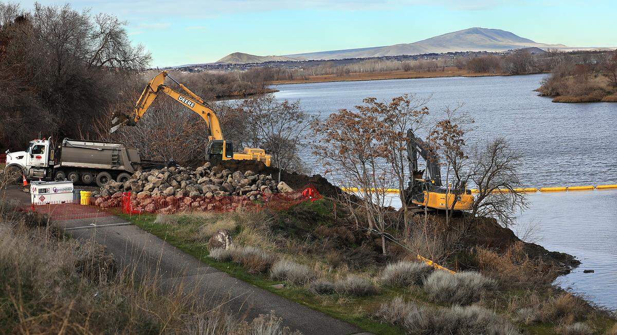 Heavy equipment works on removing the final remnants of the causeway to Bateman Island near the Yakima and Columbia Rivers in early February 2026.