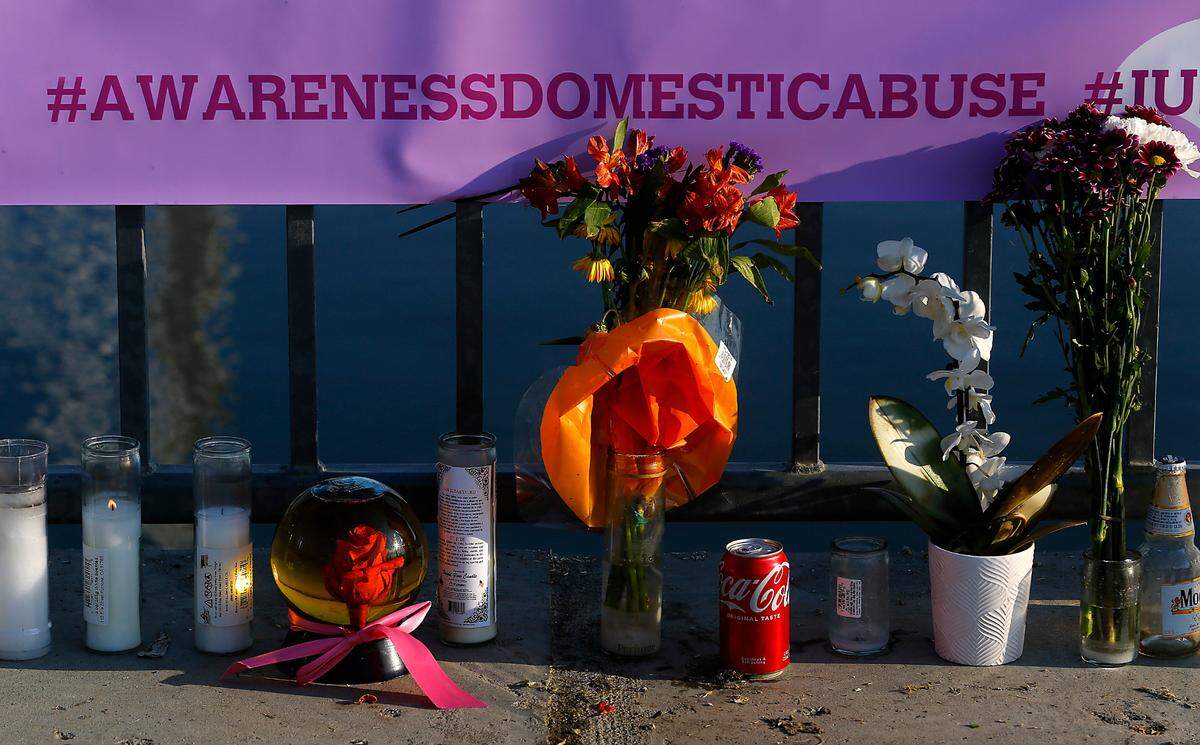 A memorial with flowers, candles and a large banner honors homicide victim Brandy Ebanez of Kennewick.