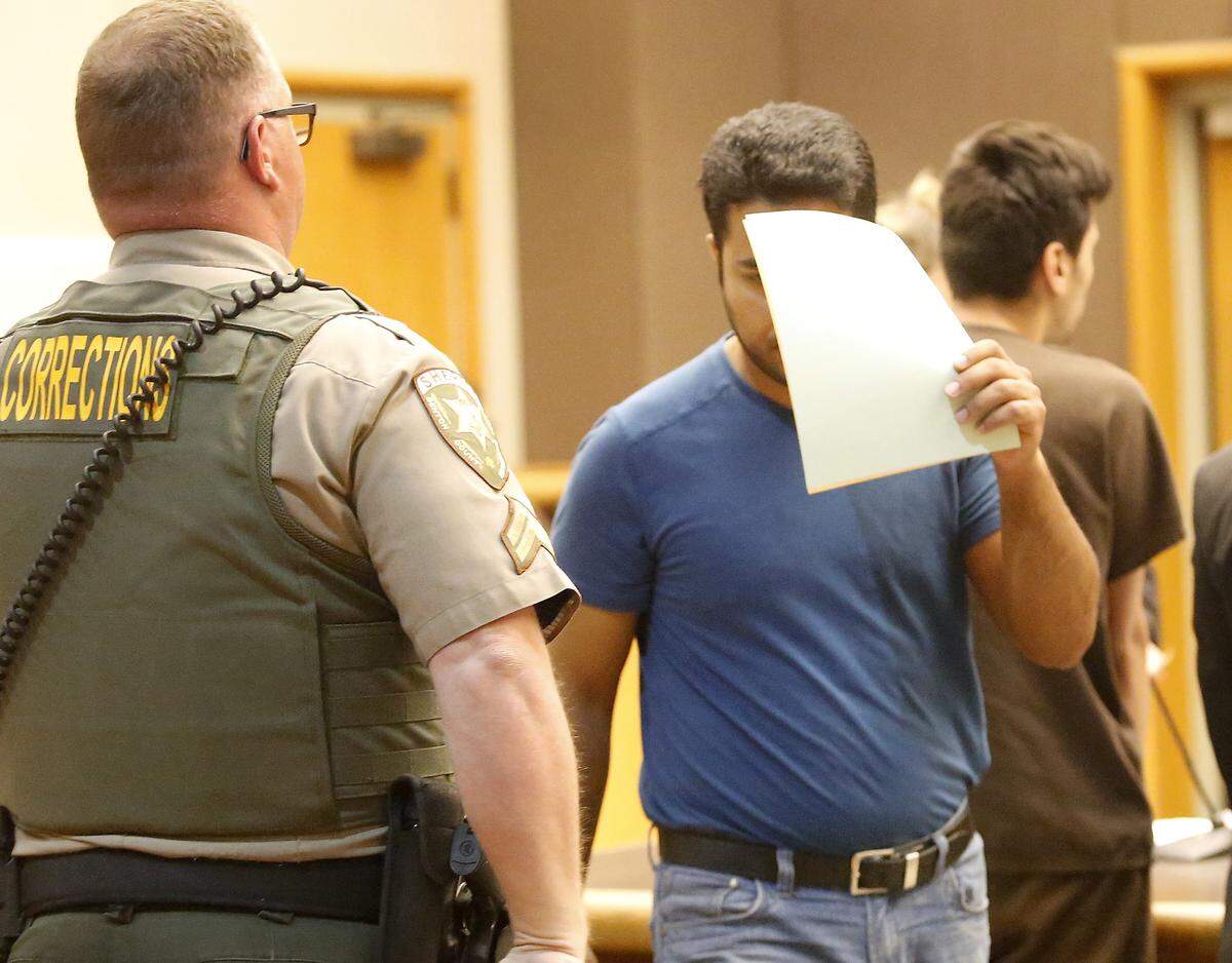 Yasir M. Majeed, now 36, covered his face during one of his first appearances in Benton County Superior Court after his arrest in the July 2017 Tri-Cities “Net Nanny Operation.” He was one of 26 men arrested over five days.