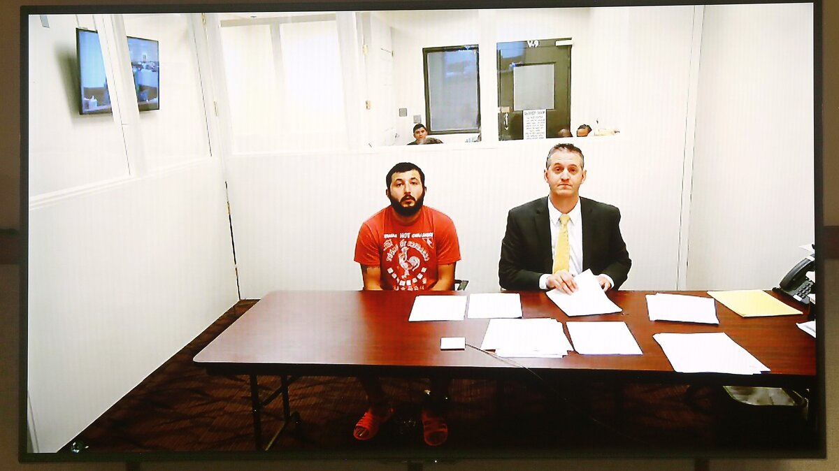 Efrain Gonzalez, 26, makes his preliminary appearance via a video link in Franklin County Superior Court with attorney Michael Quillen, right.