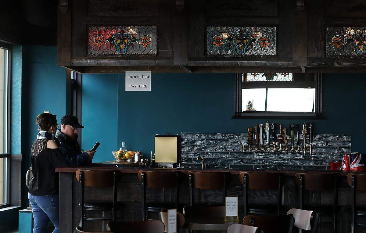 The custom “cloud” suspended above the bar inside Blackthorne Neighbourhood Pub was constructed out of the high quality wood planks from the shelves from the previous shoe store tenant in downtown Kennewick.