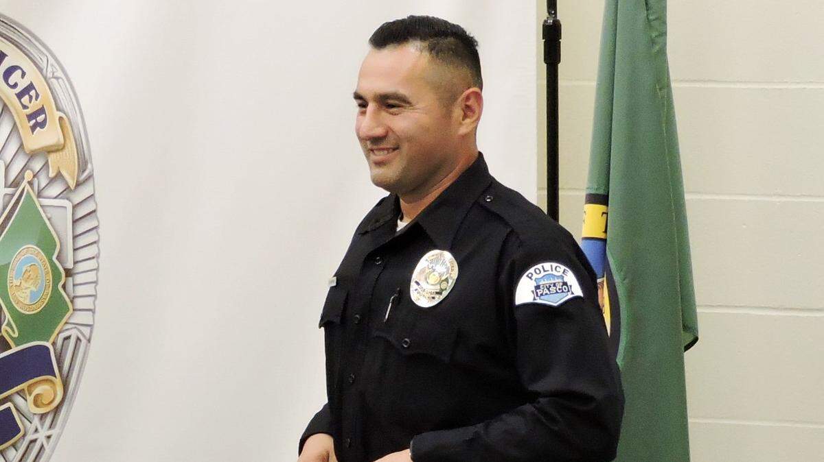 A Pasco police officer is accused of unlawful imprisonment and domestic violence assault.