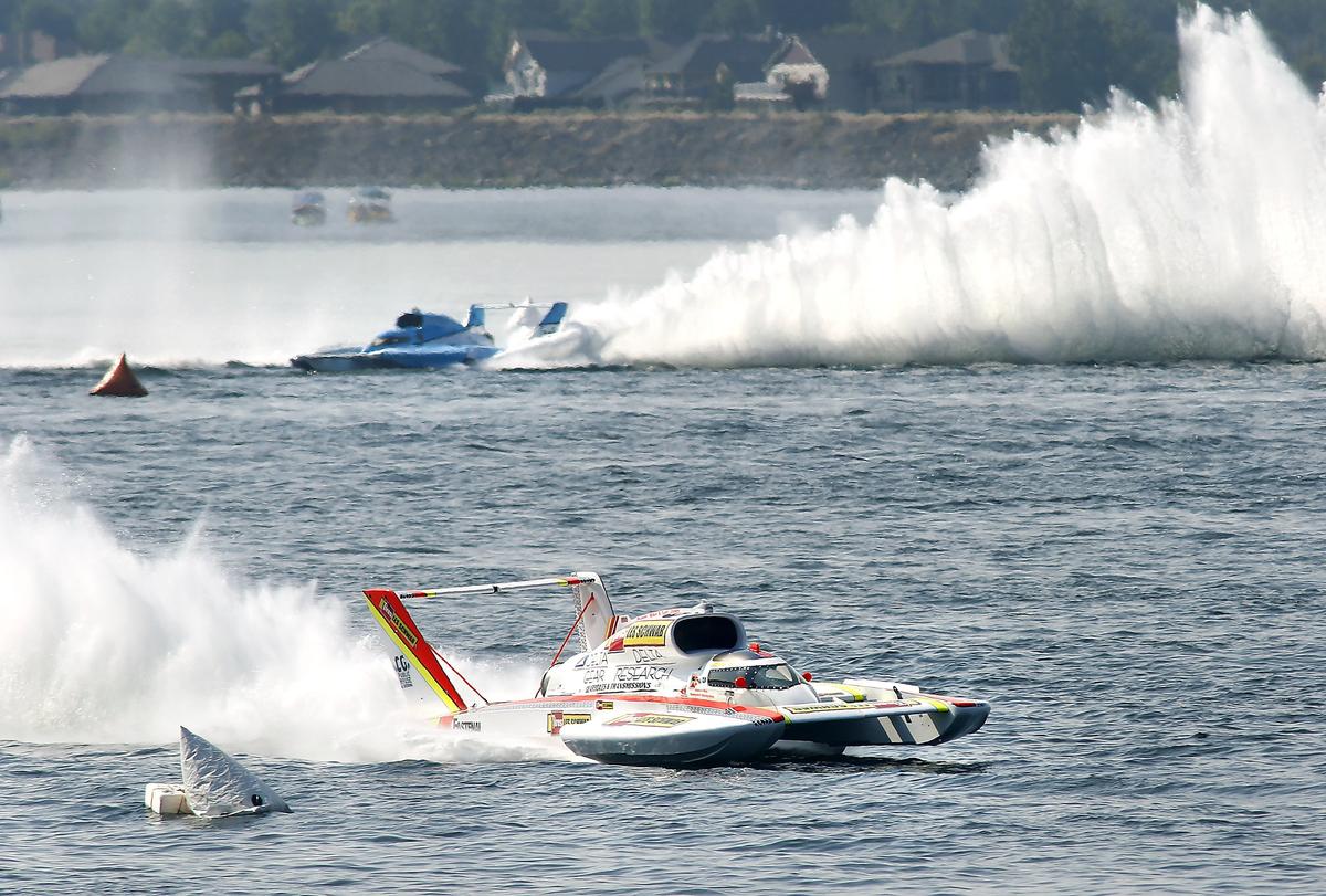 Andrew Tate in the U-9 unlimited hydroplane cruises to victory in the championship race in front of Jimmy Shane in the U-1 on the Columbia River.