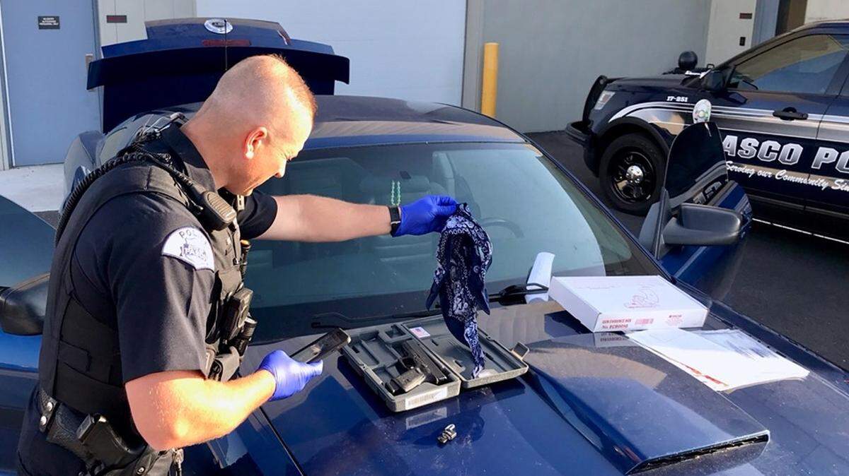 Pasco police found a stolen gun inside of a car that was taken from Toppenish and found on Douglas Avenue.