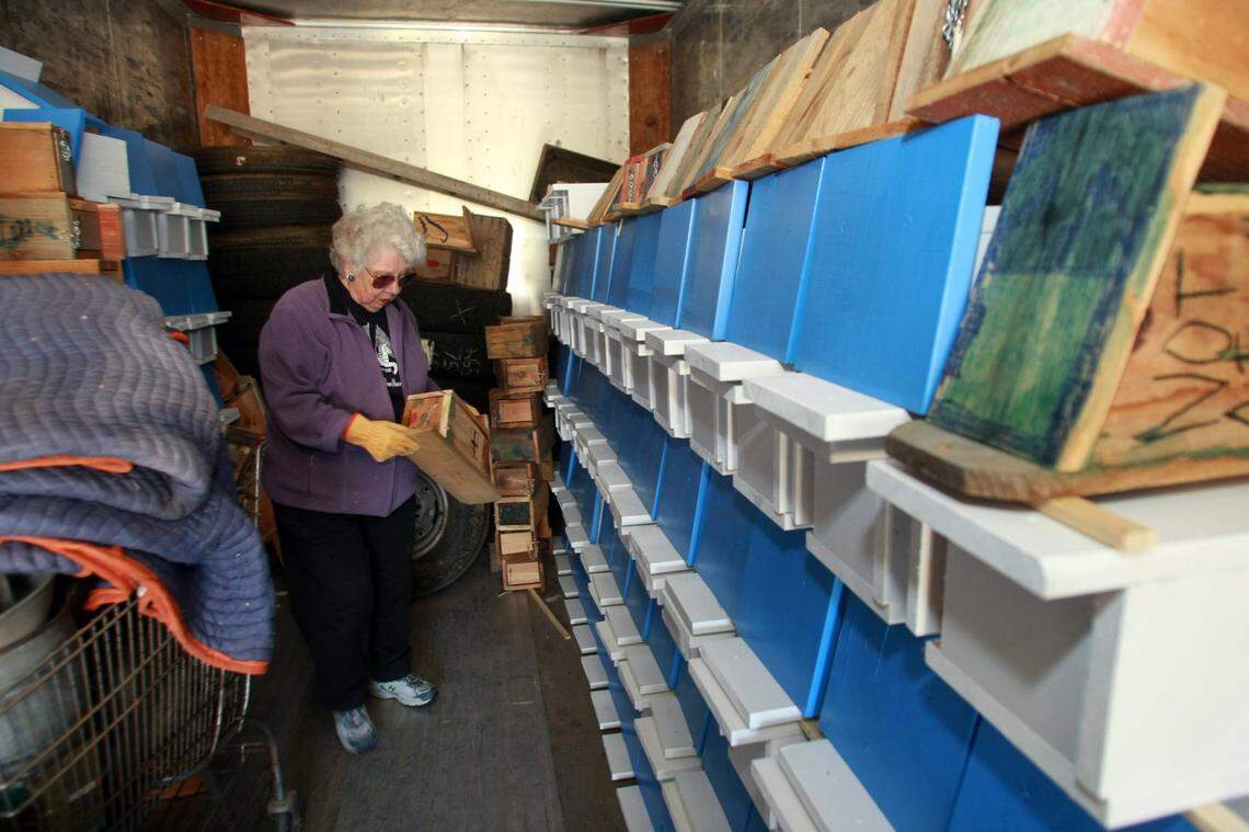 Ada Ruth Whitmore shows some of the nearly 500 Bluebird nesting boxes they have stored in a shipping container at their home near Bickelton. Herald/Bob Brawdy #10