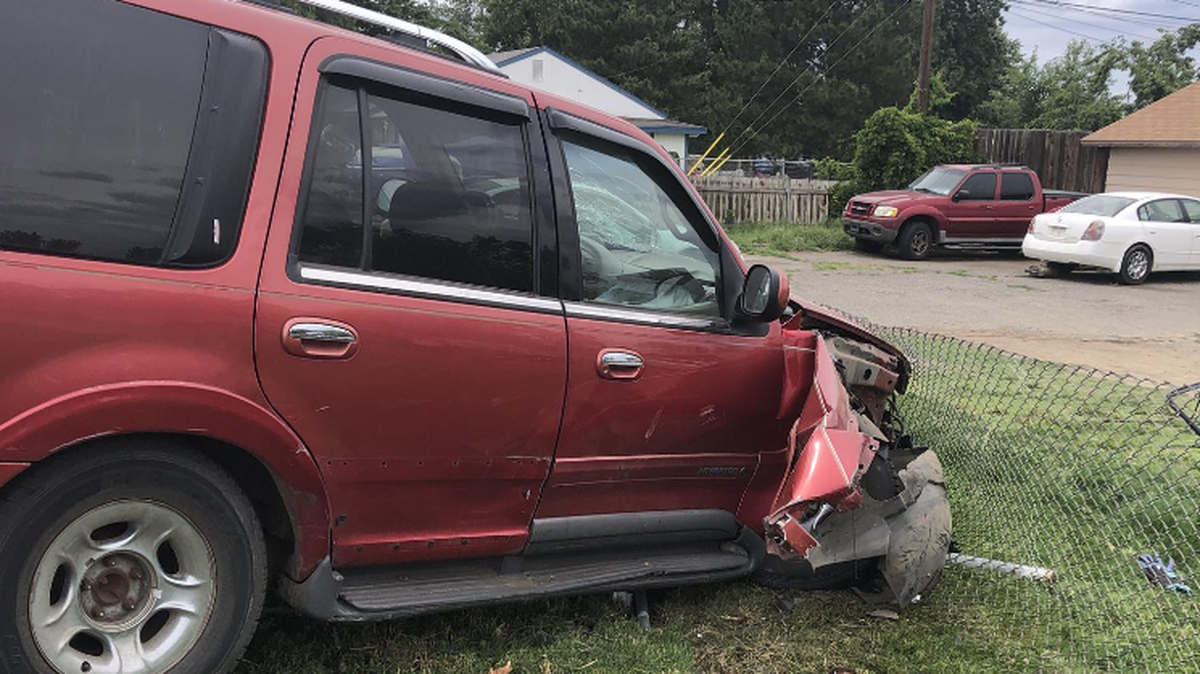 A drunk driver crashed into a fence before getting into an argument with another driver and pulling a gun.