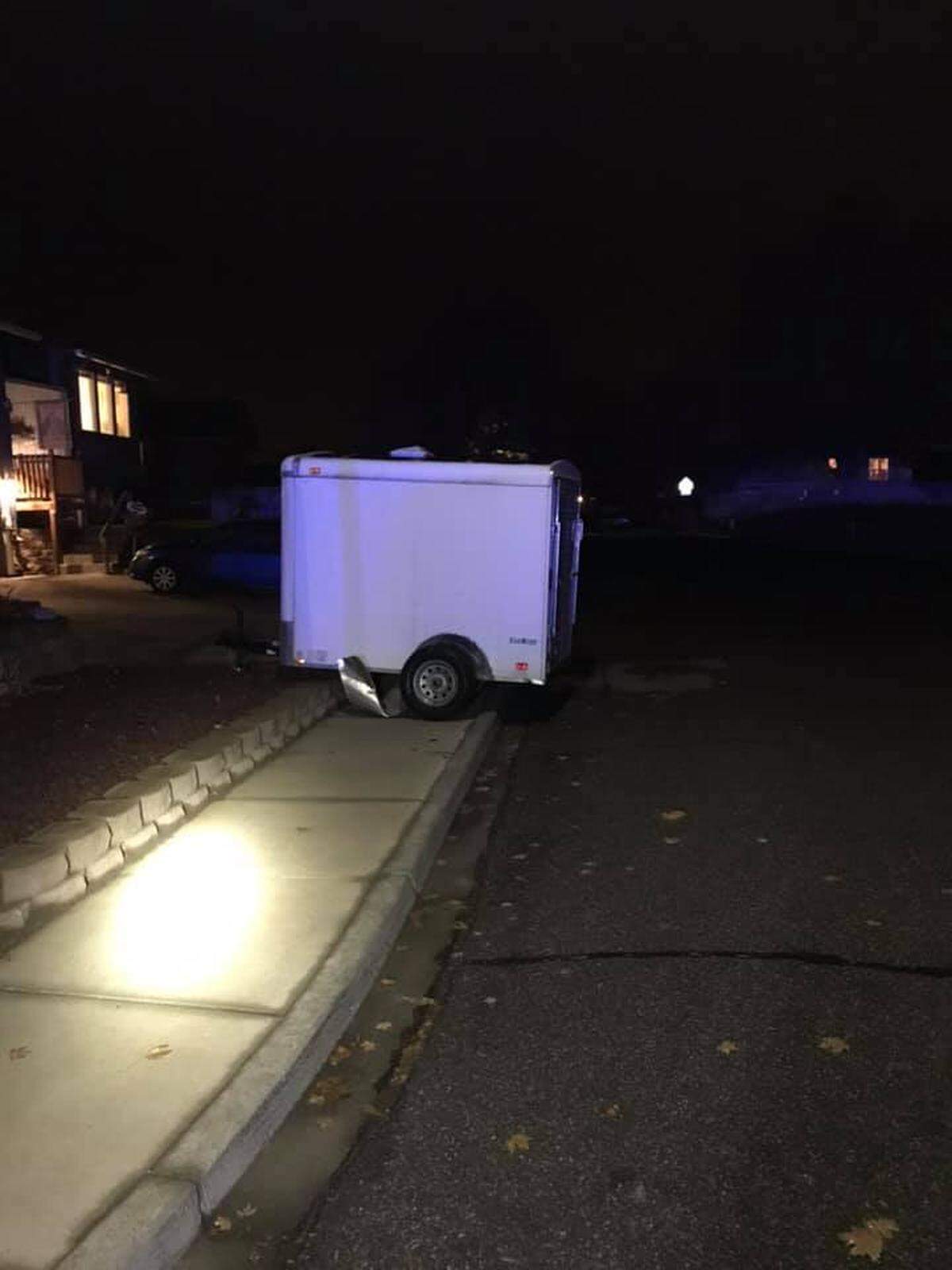 Children were in the car when an accused drunk driver hit this parked trailer Saturday evening, according to Kennewick police.