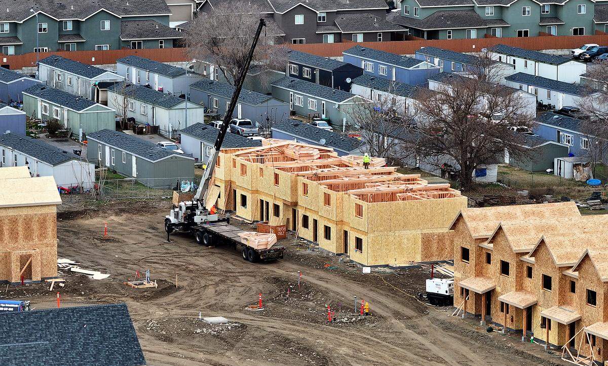 Construction crews works at the new $19 million Sunset Ridge Town Homes project being built by the Kennewick Housing Authority at the corner of East 13th Avenue and South Gum Street.