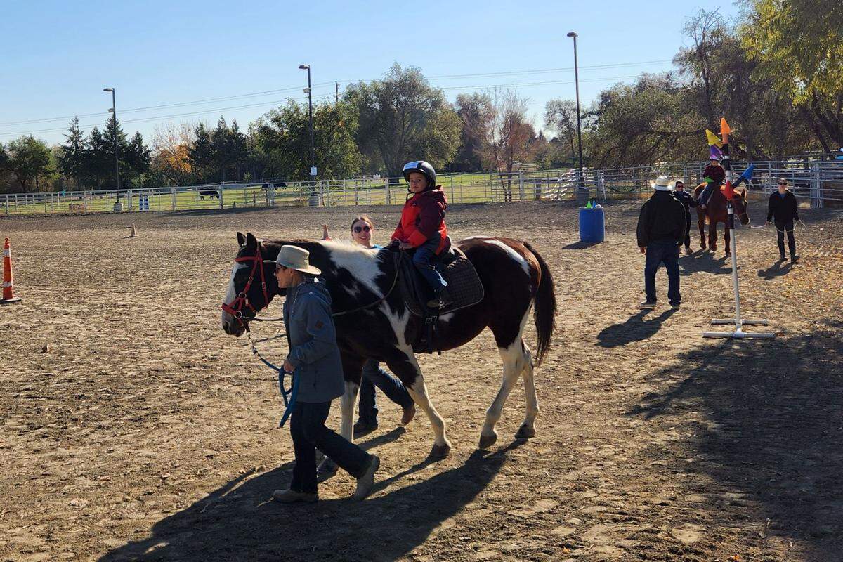 A young rider participates in a Therapeutic Riding of Tri-Cities (TROT) program.
