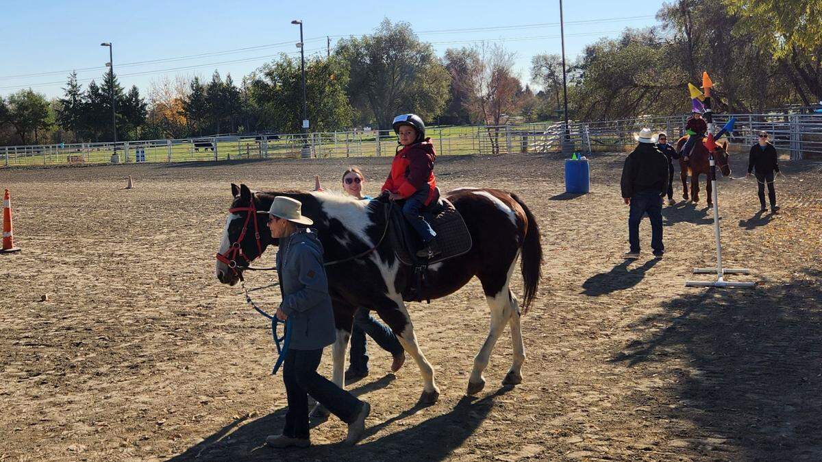 A young rider participates in a Therapeutic Riding of Tri-Cities (TROT) program.