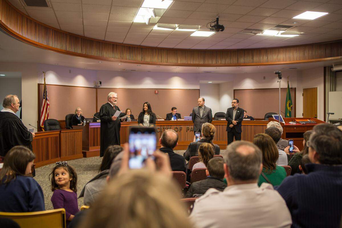 Zahra Roach was sworn in as Pasco’s newest council member on Dec. 9, 2019, by Franklin County District Court Judge Jerry Roach, in the robe to her right. Councilmen David Milne and Ruben Alvarado were issued the oath of office by Pasco Municipal Court Judge Craig Stilwill, in the robe far left.