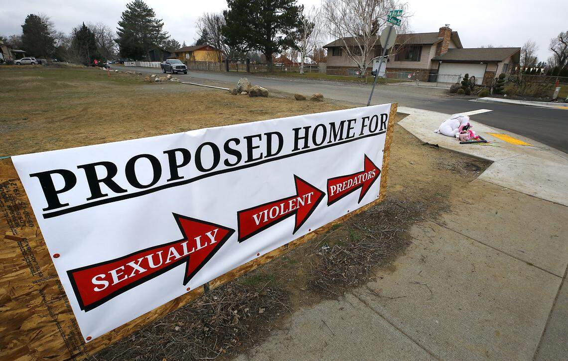 Neighbors in the area off West Eighth Avenue have placed a banner along Edison Street in Kennewick opposing the decision to allow a home for sex offenders. 