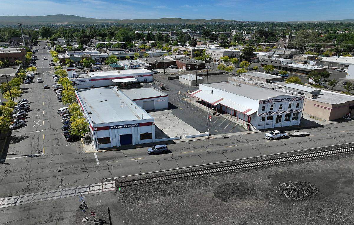 A Pasco couple closed a deal for one of the Farmers Exchange buildings in Kennewick in April and has submitted plans for a gallery and retail complex at the iconic site.