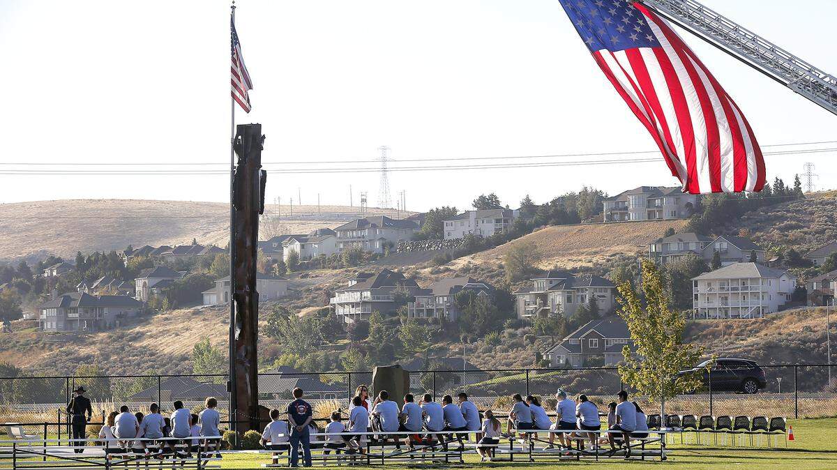 The 16th annual Kennewick 9-11-2001 memorial program begins with the posting of the guard at the Southridge memorial followed by a series of moments of silence for those killed in the attacks.