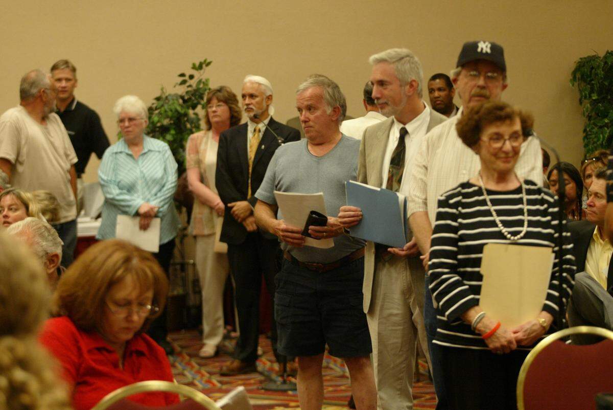 People line up to ask questions of top Hanford leaders at a Hanford State of the Site meeting in 2005, back when the meetings were scheduled annually.