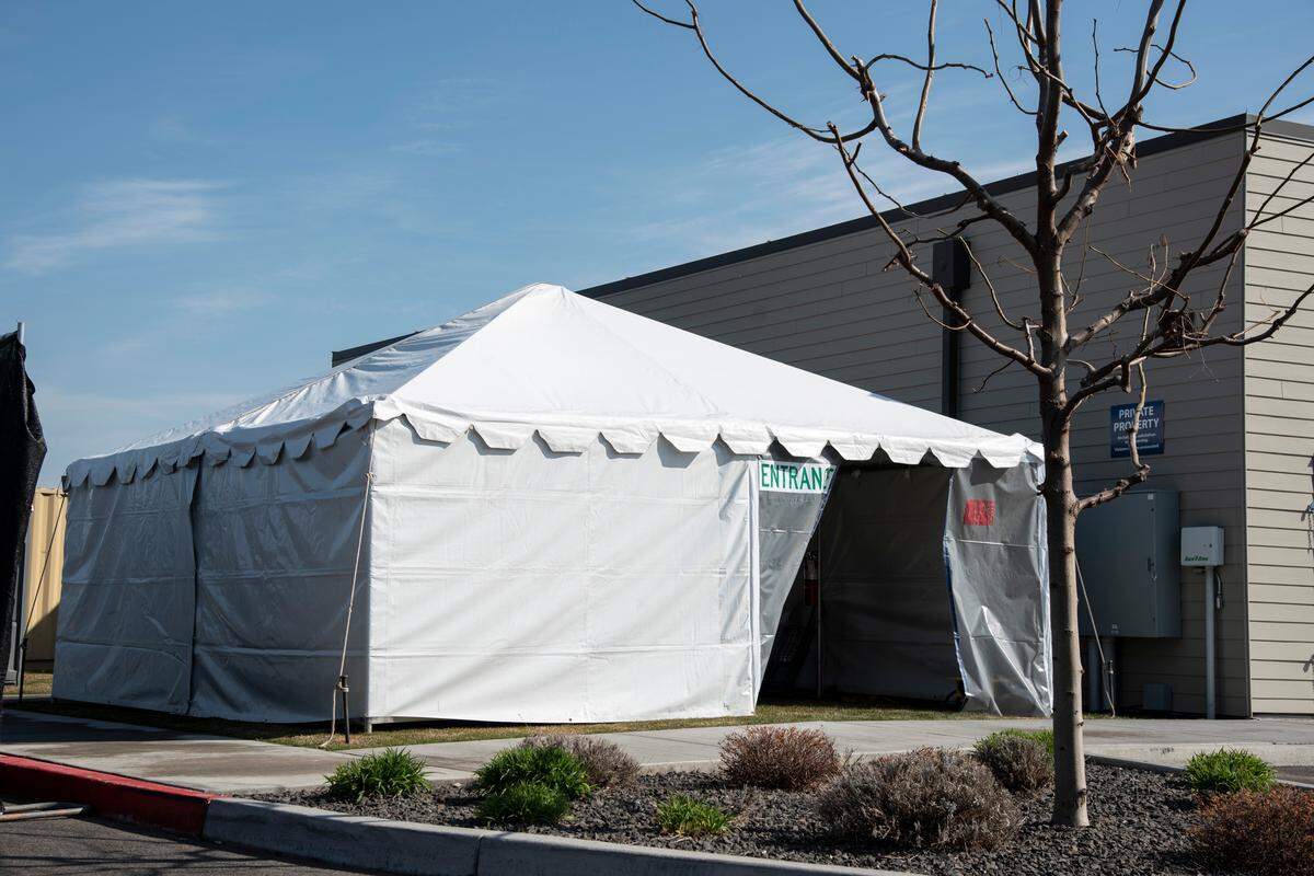 A tent is set up behind the Kadlec Urgent Care in Kennewick as a COVID-19 testing site for Kadlec patients referred there by their primary care doctors. The separate facility is meant to cut down on the possibility of exposure to other Kadlec patients going to clinics for care unrelated to the outbreak.
