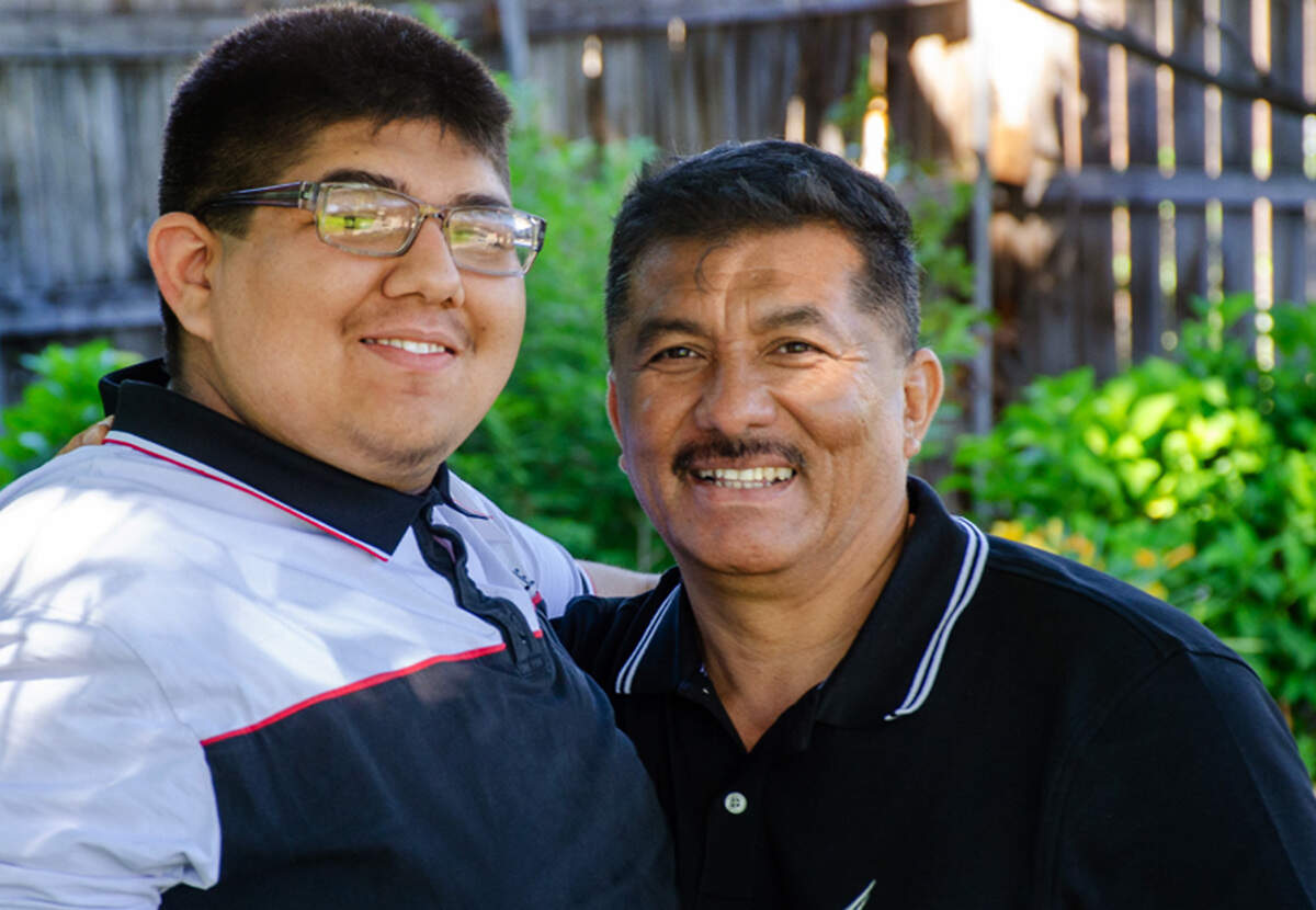 Salvador Camacho Campos, 17, of Pasco, embraces his father, Juan Campos Gomez, 53.