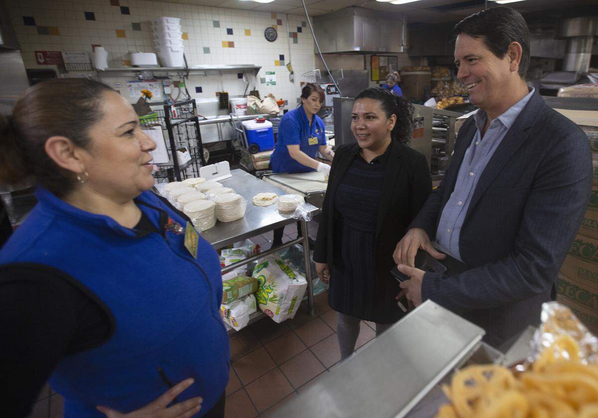 Fiesta Food’s Ana Ruiz, center, introduces Blanca Alcaraz, left, to Walter Alejandro Oldenbourg Ochoa, the secretary of economic promotion for Colima, Mexico, inside of Fiesta Foods in Pasco on Wednesday. Alcaraz and Ruiz are both from Colima.